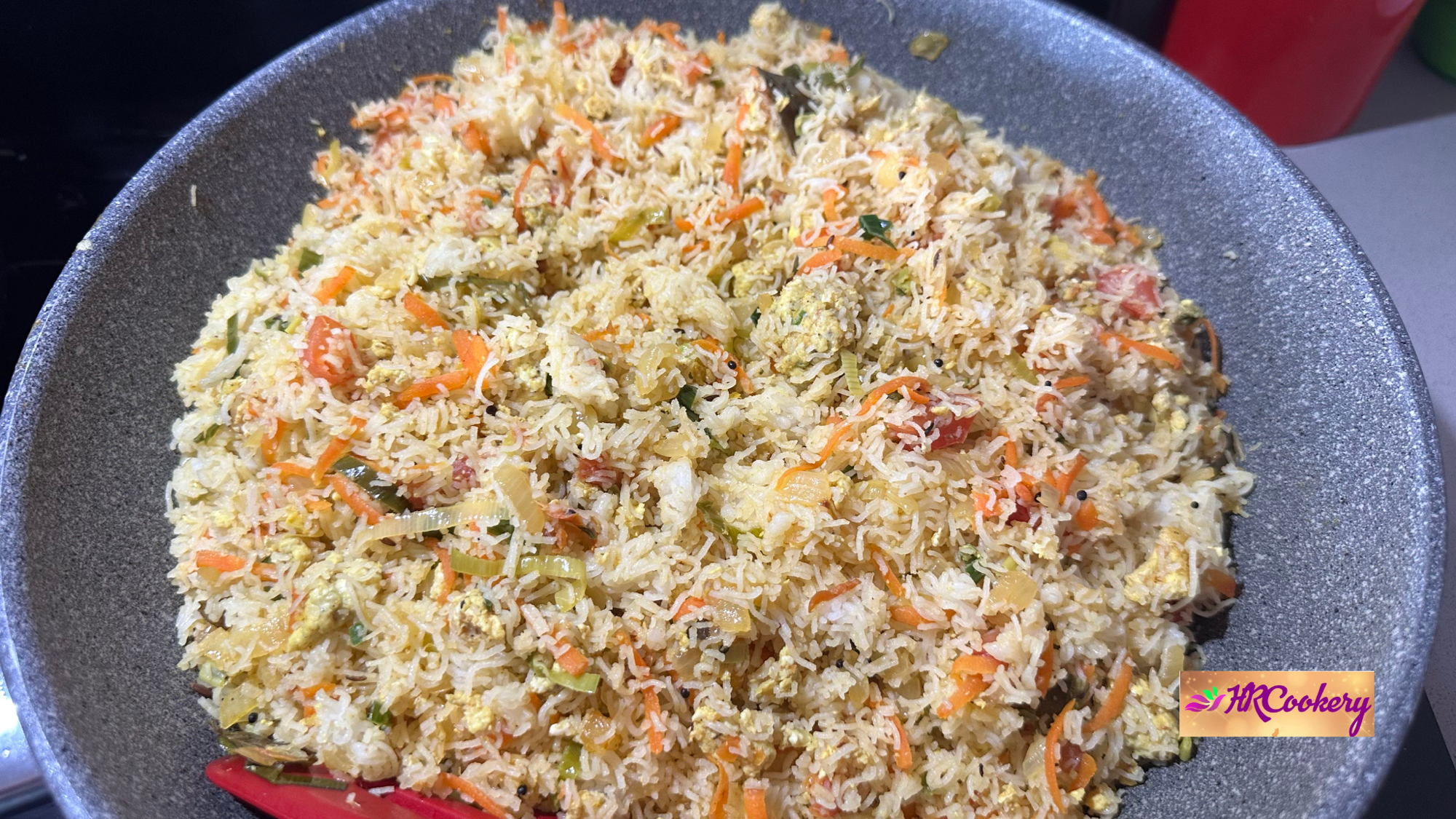 Cooked idiyappam mixed with vegetables and scrambled eggs in a wok to make Sri Lankan Kottu Idiyappam.