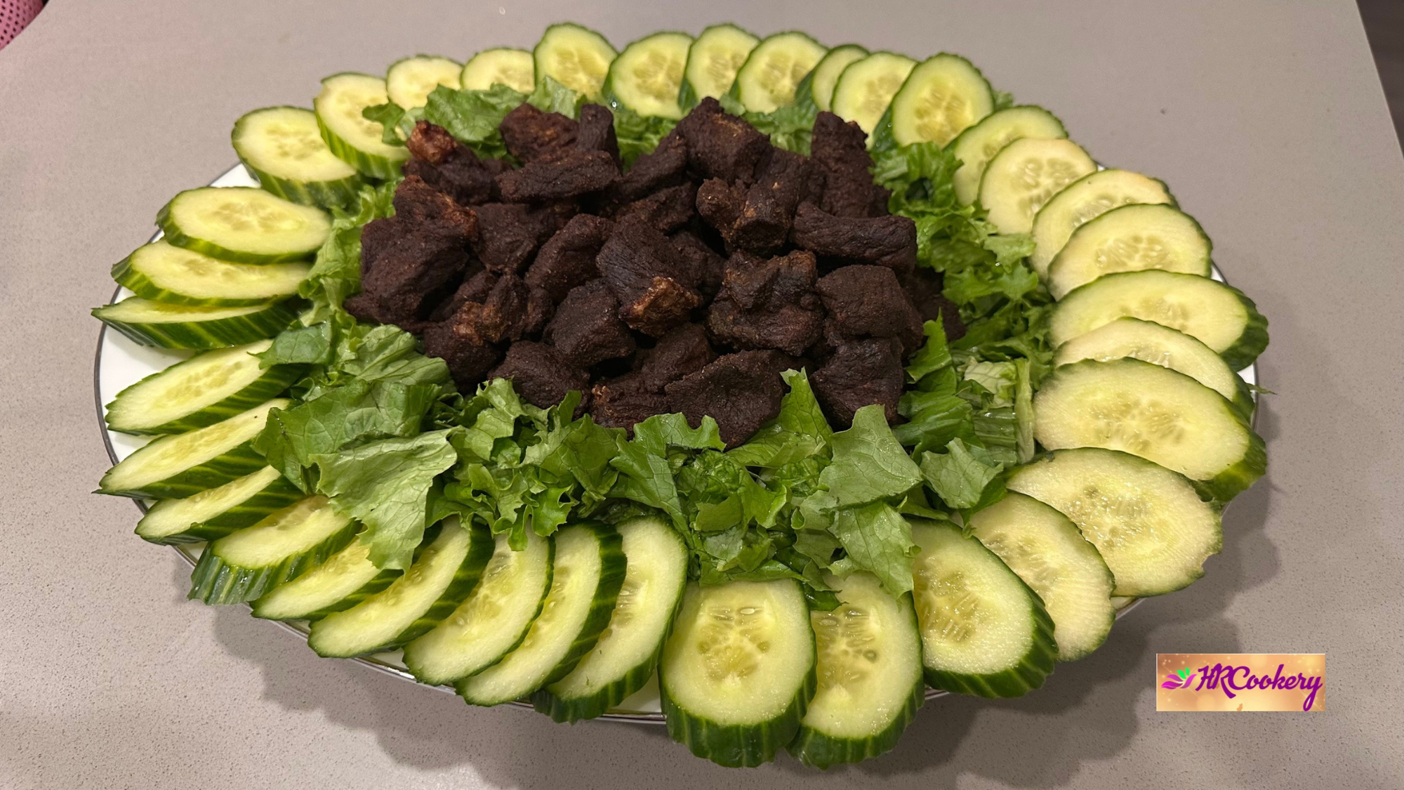 Sri Lankan beef salad with spiced beef, fresh lettuce, and sliced cucumber